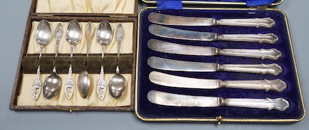 A set of six silver coffee spoons and a set of six silver handled tea knives